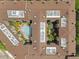 Top-down aerial view of a multi-building apartment complex and a swimming pool in the central courtyard at 911 N Orange Ave # 352, Orlando, FL 32801