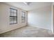 Neutral bedroom with natural light from two windows and a ceiling fan at 911 N Orange Ave # 352, Orlando, FL 32801
