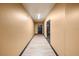 Clean and well-lit hallway with light brown flooring at 911 N Orange Ave # 352, Orlando, FL 32801