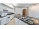 Modern kitchen featuring stainless steel sink, granite counters, and ample cabinet storage at 911 N Orange Ave # 352, Orlando, FL 32801