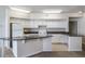 Bright kitchen with white cabinetry, granite countertops, and modern appliances provides a perfect cooking space at 911 N Orange Ave # 352, Orlando, FL 32801