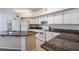 Well-equipped kitchen features granite countertops, ample cabinet space, and bright, neutral tones at 911 N Orange Ave # 352, Orlando, FL 32801