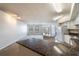 Bright living room boasts granite counters, modern appliances, and a view to the outdoors at 911 N Orange Ave # 352, Orlando, FL 32801