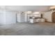 Open-concept living area features a kitchen with modern appliances and space for dining and lounging at 911 N Orange Ave # 352, Orlando, FL 32801