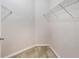 An empty walk-in closet features white walls and wire shelving for optimal storage solutions at 911 N Orange Ave # 352, Orlando, FL 32801