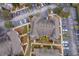 An aerial view showcasing a townhouse and surrounding parking areas at 9141 Lee Vista Blvd # 305, Orlando, FL 32829