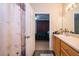 Bathroom with a shower and view into bedroom at 9141 Lee Vista Blvd # 305, Orlando, FL 32829