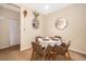 Dining area with a round table and four brown chairs at 9141 Lee Vista Blvd # 305, Orlando, FL 32829