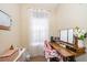 Home office with built-in desk and window providing natural light at 9141 Lee Vista Blvd # 305, Orlando, FL 32829