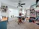 Bright craft room with ample storage, a large window, and a ceiling fan at 9263 Lake Lotta Cir, Gotha, FL 34734