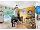Cozy dining room with a table, eclectic decorations, and a sliding glass door to the deck at 9263 Lake Lotta Cir, Gotha, FL 34734
