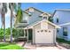 Charming two-story home with mature landscaping and attached garage at 9263 Lake Lotta Cir, Gotha, FL 34734