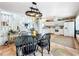 Open-concept kitchen and dining area featuring white cabinets and tile floors at 9263 Lake Lotta Cir, Gotha, FL 34734