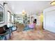 Open-concept living room with tile floors and views of the backyard at 9263 Lake Lotta Cir, Gotha, FL 34734