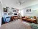 Cozy living room with comfortable seating and charming decor and carpet flooring at 9263 Lake Lotta Cir, Gotha, FL 34734