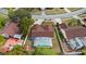 Aerial view featuring a backyard with screened-in pool and fenced yard at 9664 Lake Douglas Pl, Orlando, FL 32817