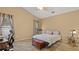 Comfortable bedroom with a chest at the foot of the bed and windows with natural light at 9664 Lake Douglas Pl, Orlando, FL 32817
