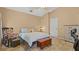 Comfortable bedroom with a chest at the foot of the bed and windows with natural light at 9664 Lake Douglas Pl, Orlando, FL 32817