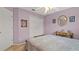 Bedroom with an ornate bed frame, closet, and a charming vanity with an oval mirror at 9664 Lake Douglas Pl, Orlando, FL 32817