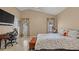 Comfortable bedroom with a chest at the foot of the bed and windows with natural light at 9664 Lake Douglas Pl, Orlando, FL 32817