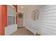 Inviting front porch featuring a bench, decorative wreath, and stylish sidelight at 9664 Lake Douglas Pl, Orlando, FL 32817