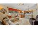 Kitchen overlooking a living room that features a reclining chair and backyard access at 9664 Lake Douglas Pl, Orlando, FL 32817