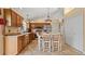 Traditional kitchen with wood cabinets, stainless appliances, and tile floors at 9664 Lake Douglas Pl, Orlando, FL 32817