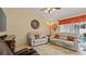 Living area with reclining chairs and a view of the backyard pool at 9664 Lake Douglas Pl, Orlando, FL 32817