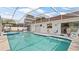 Relax and unwind in this screened-in pool and patio area at 9664 Lake Douglas Pl, Orlando, FL 32817