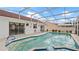 Enjoy a refreshing swim in this screened-in pool with patio seating at 9664 Lake Douglas Pl, Orlando, FL 32817