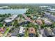 Aerial view of the Cloisters Condominiums with pool and lakefront access, surrounded by lush trees at 100 S Interlachen Ave # 203, Winter Park, FL 32789