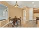 Charming dining room with decorative table and chairs, pendant lighting, and window to outdoor space at 1000 Parasol Pl, Oviedo, FL 32766