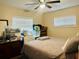 Spacious bedroom with a queen-size bed and ample closet space at 1002 Jamela Dr, Ocoee, FL 34761