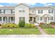 Beautiful townhome with neutral colors and a well-manicured lawn and flower beds at 11912 Boldface Dr, Orlando, FL 32832