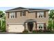 Two-story house with a neutral color scheme and a two-car garage at 1281 Limbali St, Mount Dora, FL 32757