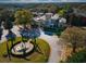 Aerial view of the clubhouse with a fountain in front and lush landscaping surrounding at 1341 Arbor Vista Loop # 321, Lake Mary, FL 32746