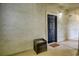 Exterior view of a unit's front door with textured walls and a small parcel drop box at 1341 Arbor Vista Loop # 321, Lake Mary, FL 32746