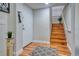 Welcoming entryway with wood floors and staircase leading to the upper level at 1341 Arbor Vista Loop # 321, Lake Mary, FL 32746