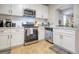 Clean kitchen featuring white cabinets, subway tile backsplash, and stainless steel appliances at 1341 Arbor Vista Loop # 321, Lake Mary, FL 32746