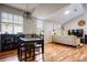 Open-concept living space with wood flooring, dining table, and neutral decor at 1341 Arbor Vista Loop # 321, Lake Mary, FL 32746