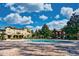 Community pool featuring a large deck, umbrellas, and a view of the clubhouse at 1341 Arbor Vista Loop # 321, Lake Mary, FL 32746