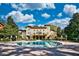 View of the pool surrounded by well-maintained landscaping and upscale residential buildings at 1341 Arbor Vista Loop # 321, Lake Mary, FL 32746