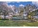 Community sign surrounded by mature trees and landscaping with a bright blue sky overhead at 1341 Arbor Vista Loop # 321, Lake Mary, FL 32746