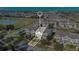 Aerial view of home in residential neighborhood close to the lake and with a 2 car garage at 13829 Ingelnook Dr, Windermere, FL 34786