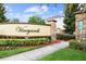 Community entrance sign with stone accents and lush landscaping welcomes residents and guests at 13829 Ingelnook Dr, Windermere, FL 34786