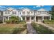 Charming townhome with landscaped front yard, brick walkway and covered front porch at 13829 Ingelnook Dr, Windermere, FL 34786