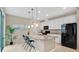 Stylish kitchen with granite countertops, white cabinetry, and stainless steel appliances at 13829 Ingelnook Dr, Windermere, FL 34786