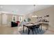 Inviting open-concept living room and dining area with tile floors and modern decor at 13829 Ingelnook Dr, Windermere, FL 34786