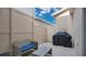 Enclosed patio with wicker furniture, a small table, and a grill covered, perfect for outdoor relaxation at 13829 Ingelnook Dr, Windermere, FL 34786