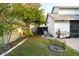 Well-maintained backyard with brick patio, grill, storage shed, and garden area at 14607 Traders Path, Orlando, FL 32837